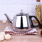 Théière Induction avec Infuseur sur un torchon 