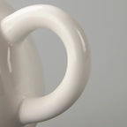 Théière Porcelaine à Motif Bleu vue sur la poignée  