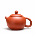 Théière en Terre Cuite de Yixing Ronde Orange sur fond blanc 